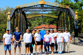 Employees and family members of Culligan of San Antonio clean up Brackenridge Park in San Antonio, TX.